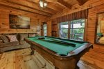 Pool table in the game room on the main level